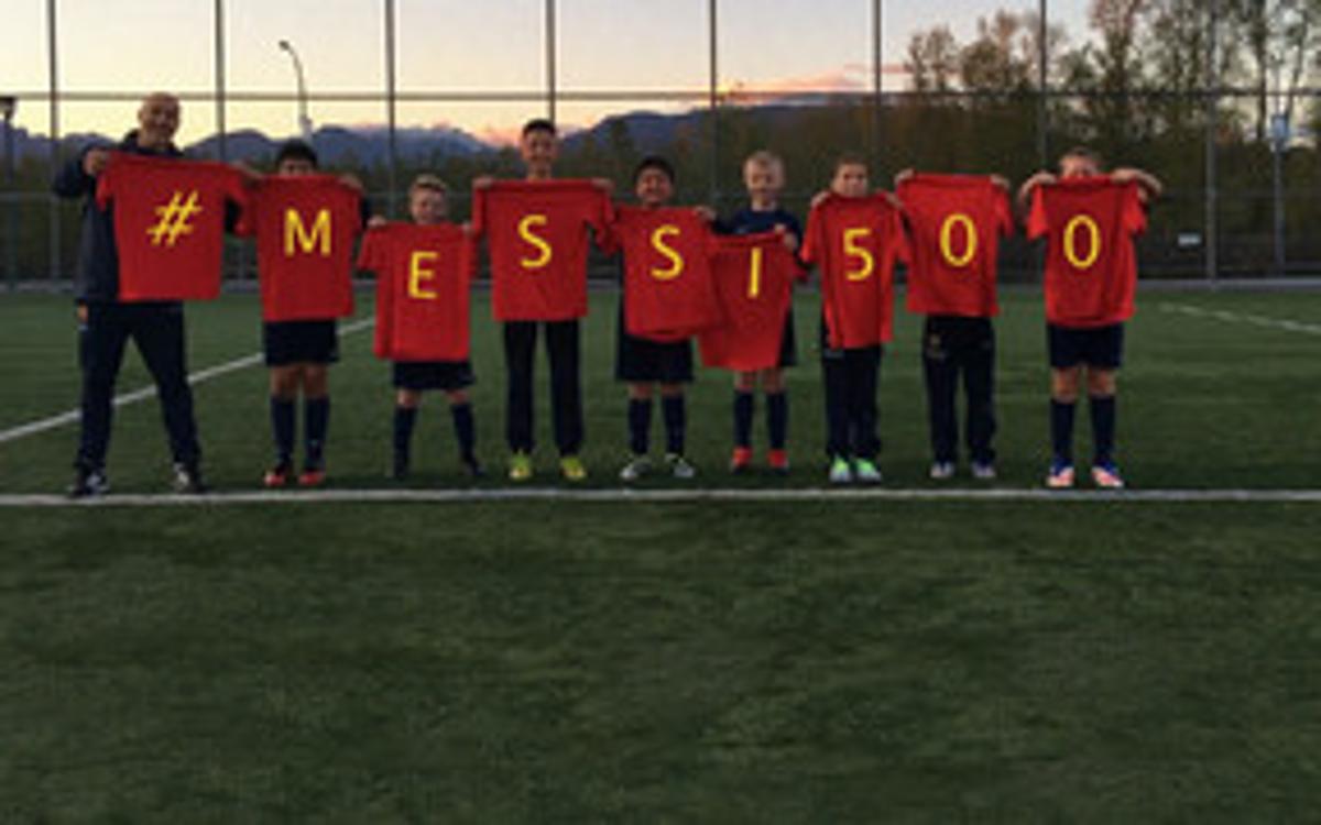 FCBEscola players from around the world congratulate Messi on his 500th goal