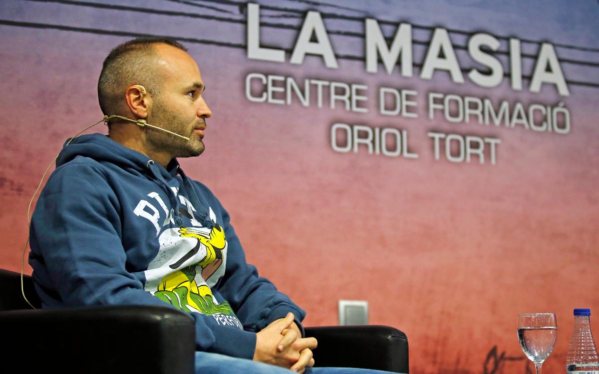 FC Barcelona's Andrés Iniesta chats to the players at the Masia Residence