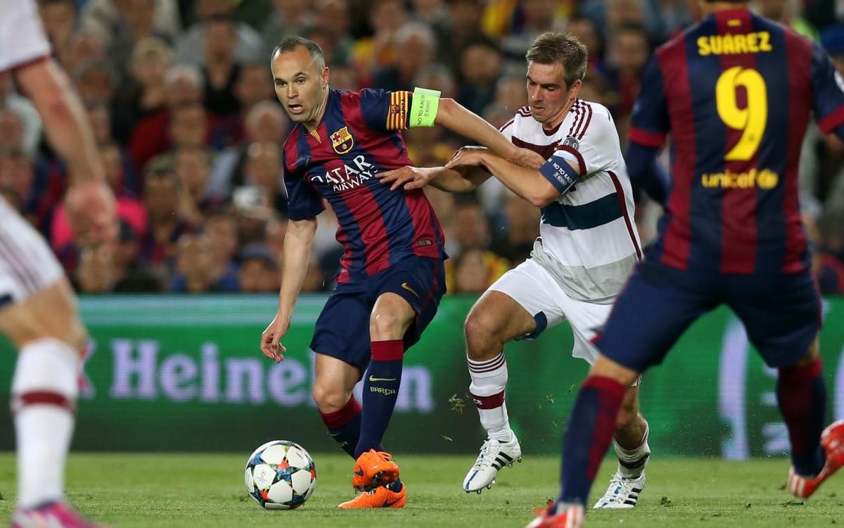 Iniesta and Lahm.