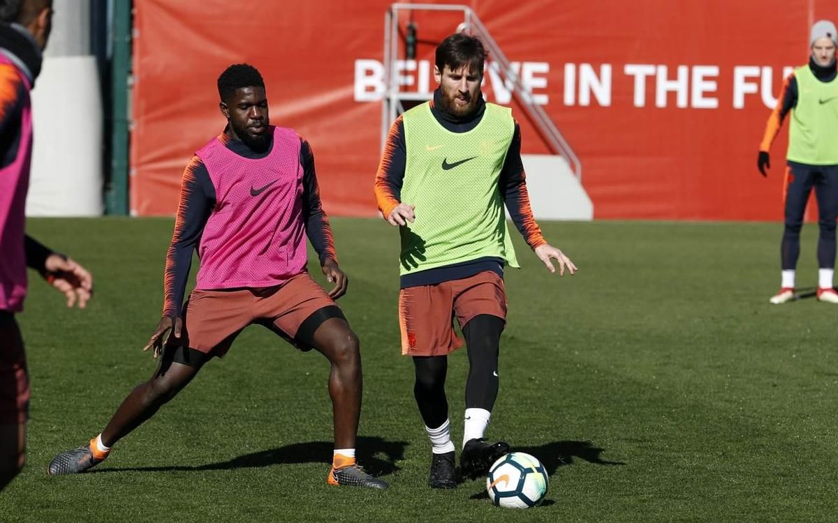 Lionel Messi and Samuel Umtiti, working hard in the training ground rondo